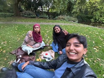 Sabirah (back left) and her two friends, Simran (back right) and Thea (front) celebrate completing their first month at Trinity College Dublin at St. Stephen's Green.